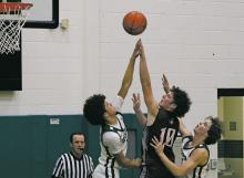 Breckenridge Buckaroos Ryan Waller (left) and Hudson Woodward attempt to block a shot by a Panther’s shooter during their 51-42 loss Tuesday, Nov. 19 to Seymour. Photo/Kylie Bailey
