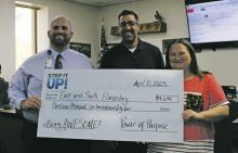A check from a fundraising company called Step It Up was presented to elementary school principals Monday, April 10 for a total of $19,644. The money was raised by students from East and South Elementary Schools earlier this year. Photo/Stevie Watkins