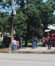 A truck overturned at the 1600 block of West Walker Street around noon on Wednesday, June 24. The overturned truck caused a power outage and water line damage in front of the Hillcrest Cleaner/Laundry. Photo by A.D. Chachere