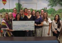 Members of Virginia’s House accepted a $21,500 check from the Run for the Children board Tuesday, July 1 from proceeds raised from the run and auction. This year’s event celebrated 20 years in Graham, with over $230,000 raised since its establishment. Photo/Thomas Wallner