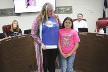 Langford presents BISD Board with check for $1,500