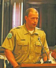 Palo Pinto State Mountains State Park Superintendent James Adams spoke to commissioners Monday during a public hearing regarding a proposed wind farm project from La Casa Wind, LLC. Commissioners voted to approve the applicaton and scheduled a second hearing for Monday, Sept. 25. Photo/Mike Williams