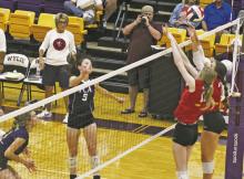 At top: Jesi Warren (5) tries to get a swing past the red team block in the second set of the Big Country FCA All-Star volleyball match. At bottom: Anson Rodgers (green helmet) tries to work past a block in the fourth quarter of the football game. Photos/Mike Williams