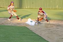 Cam Escalon slides and beats out a throw to steal second base during the third inning Tuesday, April 23 during the Bucks' 7-0 win over Millsap. Photo/Mike Williams