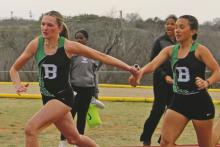 Kamden Tidwell takes the baton from teammate Abbigail Duran during the 4x200-meter relay in the 2025 Buckaroos Relay. Tidwell and Duran scored top marks during the Lobo Relays held Wednesday, March 4 at Cisco High School. (Archive photo)