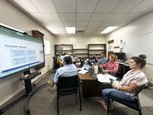 BISD board members watch a presentation from Texas Association of School Boards Assistant Director of Human Resource Services Zachary Hobbs during a meeting Tuesday, July 27. Photo/Mike Williams