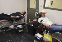 Breckenridge Police Chief Blake Johnson (left) and Stephens County Sheriff Kevin Roach (right) make their donations to the Battle of the Badges Blood Drive that took place June 6-7. The Stephens County Sheriff’s Office one last year’s battle. This year’s winner will be announced at a Breckenridge Rotary Club meeting later this summer. Photo/Mike Williams