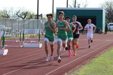 (In order) Adrian Saucedo, Chance Stewart (in glasses) and Nathan Oxte lead the field in the boys’ varsity 3200-meter run Thursday, March 21 at the Buckaroos Relays. Photo/Mike Williams