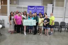 Miss Breckenridge 2024 MacKenzie Cloud presents a check to Cafe of Love at First Methodist Church of Breckenridge during a presentation Tuesday, Sept. 10. Photo/Mike Williams