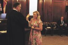 District Clerk Stephanie Elder is sworn in by 90th Judicial District Judge Phillip Gregory during a ceremony held Friday, May 31 at the Stephens County Courthouse. Photo/Mike Williams