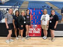 Pictured left to right: Coach Rachel Buse, Janet Sullivan, Coach Karen Martinson, Ella Sullivan, Woodson High School Athletic Director Melissa Vickers, and Coach Lisa Jo Jones. Contributed photo