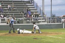 Alexis Franco beats a tag at home plate to score a run during the third inning of the Bucks’ 5-1 win Friday, March 22 at home over Early. Photo/Mike Williams