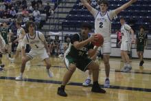 (Photo/Alex Kielar) Joacim Fernandez posts up in the paint during the second half of the Buckaroos game against Peaster in which they were handed their first district loss Friday, Jan. 16. 