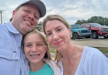 (Contributed Photo) Milly Cate McClymond reunites with her parents, Nic and Courtney, after she was rescued from Camp Mystic following devastating flooding that hit the camp July 4 weekend. 