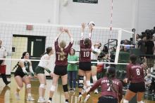 Lady Bucks senior Joni Jackson tries to get a ball past the Monarchs' block during the first set of the Lady Bucks 3-1 loss to Poolville Tuesday, Aug. 13. Photo/Mike Williams