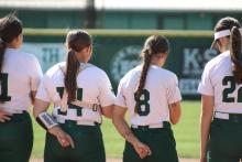 (Photo / Alex Kielar) Joni Jackson, left, and Olyvia Perez stand during the National Anthem before their Senior Night game Tuesday. Both seniors were key to the Lady Bucks 9-3 win over Millsap.