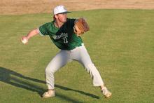 (Photo/Alex Kielar) Preston Burns, who pitched in relief of Cam David, fields a bunt in the third inning before throwing out the runner at first during the Bucks’ opening game of the season Monday, Feb. 16. 