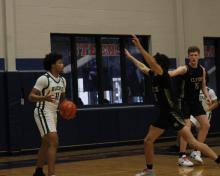 (Photo/Alex Kielar) Douglas White with the ball during the Bucks’ third-place game matchup against the Clyde Bulldogs in the Graham Tournament Saturday, Dec. 13. 