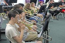 (Photo/Alex Kielar) The Breckenridge High School band trombone players practice their part of the Buckaroo Fight Song during the first full band practice to kick off summer band camp Tuesday, July 22. 