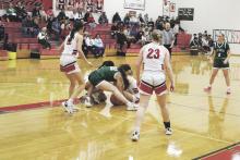 Destiny Jamison (22) playing in her first game after recovering from a knee injury fights for a loose ball during the fourth quarter of the Lady Bucks’ 77-56 loss at Eastland. Jamison finished the game with 10 points. Photo/Mike Williams
