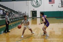 Joseph Juneau makes an inside pass during the second quarter of the Bucks’ 54-39 win Tuesday, Jan. 9 over Early. Juneau finished the game with 16 points. Photo/Mike Williams