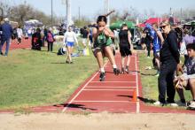 Breckenridge Junior High School seventh grader Lakyla Bartley completes a jump of 14-2 to finish fourth in seventh-grade girls long jump Tuesday, March 25 at the District 8-3A Junior High Track Meet. Photo/Mike Williams