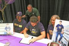 Caiden Marin signs his letter of intent to continue his athletic career at Hardin Simmons University in Abilene. Photo/Mike Williams