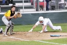 Caiden Marin slides home and beats the throw to score the lone run in the Bucks’ 1-0 win Friday, April 12 over Dublin. Photo/Mike Williams