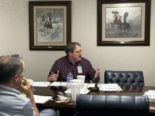 Stephens Memorial Hospital CEO Brian Roland speaks to the board during the March 28 meeting. Photo/Mike Williams