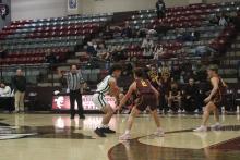 (Photo/Alex Kielar) Ryan Waller holds the ball against a Bells defender Monday, Dec. 29 in the first half of the Bucks’ first game in the Eula Holiday Classic. The Bucks went 2-2 overall in the tournament. 
