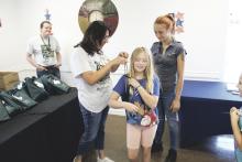 Stephens Memorial Hospital hosted its annual Back to School Bash in the hospital’s business office Thursday, July 25. Breckenridge ISD students were able to receive free drawstring backpacks filled with school supplies. Later in the evening the board of trustees voted to propose the 2025 budget and 2024 tax rate.  Photo/Mike Williams