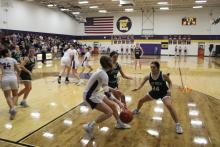 Lady Bucks Ruthie Valez (3) and Analia Palacios (24) double-team a Lady Longhorn midway through the fourth quarter of the Lady Bucks’ 50-42 win Friday, Feb. 2 at Early High School.  Photo/Mike Williams