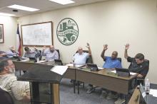 City Commission Places 1 and 2 held by Blake Hamilton (Place 1, far right) and Rob Durham (Place 2, next to Hamilton) were contested in this year’s May election. Bob Sims (middle) ran unopposed for Mayor. File photo