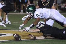 (Photo/Alex Kielar) Douglas White goes down to recover a Clyde fumble in the first quarter of the district opener Friday, Oct. 10 