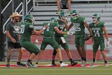 (Photo/Alex Kielar) The Bucks offense celebrates after senior receiver Arrion Mathews (25) broke off a long catch and run touchdown Thursday, Aug.14 during the scrimmage against Castleberry and Gainesville in Fort Worth. 