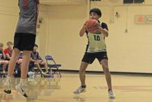 (Alex Havardansky/The Graham Leader) Kevin Araujo fakes a pass against an Olney defender Monday, Oct. 13 during the final week of the Graham fall basketball league.
