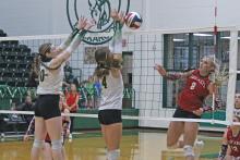 (Photo/Alex Kielar) Preslie Malcuit and freshman LaKyla Bartley work defensively to block an attempted kill by an Eastland player at the front line Tuesday, Sept. 16. Both players were key factors in the Lady Bucks coming back from a two-set deficit in the home match. 