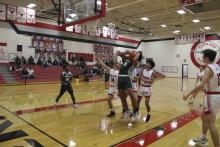Douglas White (21) fights for a rebound during the second half of the Buckaroos’ 85-33 win at Eastland. White finished the game with five points. Photo/Mike Williams