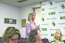 Whitney Hill, of FBMC Benefits Management explains what her role would be as the Breckenridge ISD’s agent of record during its April 8 board meeting.  Photo/Mike Williams