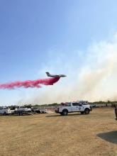 A Texas A&M Forest Service plane provides air support Monday, Aug. 12 in battling the Robertson Fire along FM 701 in Stephens County. Contributed photo/Stephens County