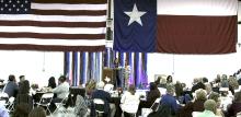Hundreds gather in a hanger at Stephens County Airport during the annual Breckenridge Chamber of Commerce.