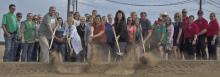 Various area government and business officials break ground on a new facility that should open sometime in 2018.