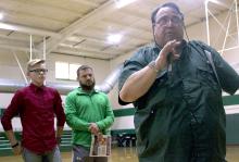 Breckenridge Junior High School student Casey Jameson and BJHS teacher Donny Funderburg look on as KEEN radio personality Rudy Fernandez talks to a crowd of BJHS students on hand for the ceremony.
