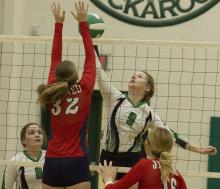 Sophomore outside hitter Madison Stanley tips the ball past a Jim Ned defender. 
