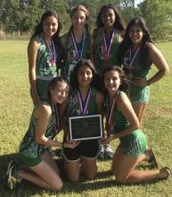 The Lady Buckaroo Cross Country Team poses for a photo with their second-place plaque.