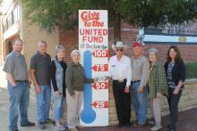 Members of the Board of Directors of the United Fund posed with their new thermometer to kick-off their new campaign, with Paul Prater (right side of thermometer) who presented his $100 dollar donation to Sandy Broyles (left side of thermometer) to get things started for 2018-2019. Other directors included (l to r) Bo Asher, Les Strickland, Sharon Wimberley, Broyles, Prater, Scott Harris, Jean Hayworth and Sherry Strickland, president. BA photo by James Norman