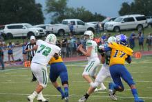 Owen Woodward drops back to complete a pass. Woodward had one touchdown on the day to Kevin Franco on the Bucks first drive. They did not score another touchdown. BA photo by James Norman
