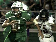 Breckenridge junior quarterback Kevin Franco scrambles away from an oncoming defender.
