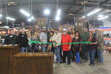 Gary Drake gets ready to cut the ribbon for Boss Oilfield Supply. Several representatives from Boss and the city were on-hand to cut the ribbon to signify the opening of the new business. Though, the business has been open since October of last year. BA photo by James Norman