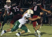 Junior defensive lineman Lane Berkley sacks Eastland’s quarterback.